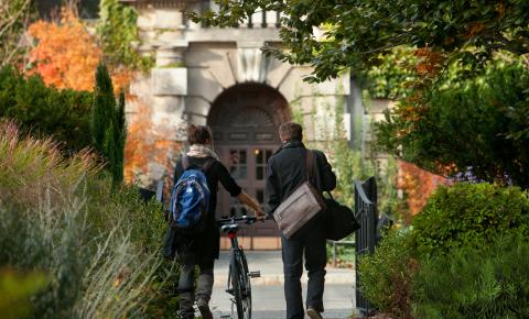 Students walk through Minns Garden towards the Plant Sciences Building in fall.
